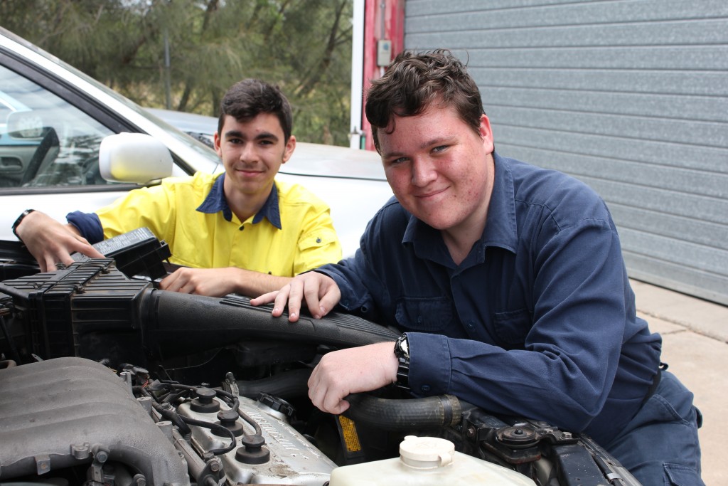 CQUniversity students Caleb McDonald and Alex Funnell check out one of the donated vehicles.