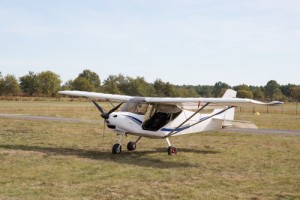 small airplane in paddock
