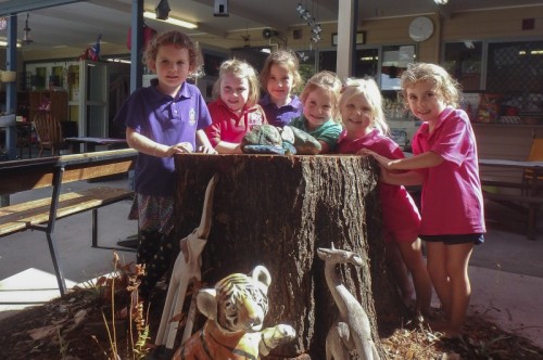 Emerald Preschool and Community Kindergarten students (L-R) Josie , Lola, Pippa, Desi, River and Thia where one of the big trees used to be.